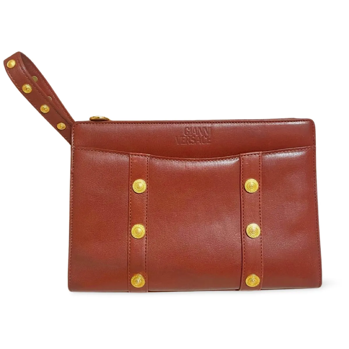 Vintage Gianni Versace brown leather wristlet, purse clutch, case bag with its iconic golden sunburst charms. Unisex bag. 061027y1