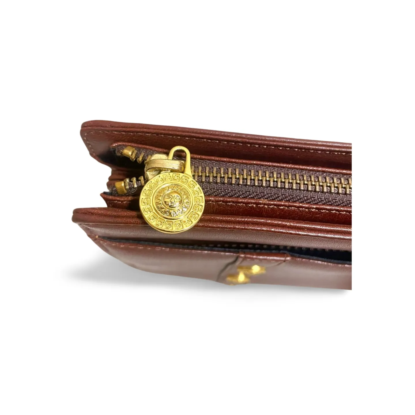 Vintage Gianni Versace brown leather wristlet, purse clutch, case bag with its iconic golden sunburst charms. Unisex bag. 061027y1
